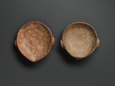 Lot 777 - A PAIR OF CERAMIC ANCESTRAL MASKS