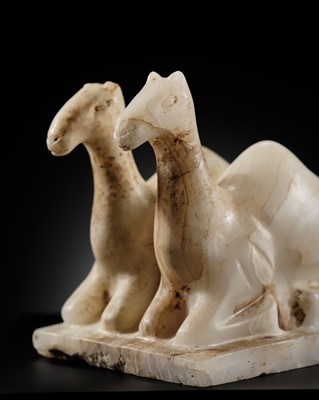Lot 384 - A SOUTH ARABIAN ALABASTER ‘CAMEL’ VOTIVE FIGURE, CIRCA 3RD-1ST CENTURY BC