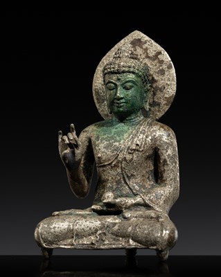 Lot 498 - A SILVER AND COPPER ALLOY FIGURE OF THE VAIROCHANA BUDDHA, CENTRAL JAVA, SAILENDRA DYNASTY, 8TH-9TH CENTURY