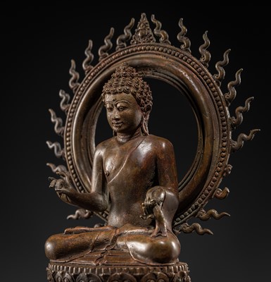 Lot 510 - A BRONZE FIGURE OF BUDDHA, MAJAPAHIT EMPIRE, 13TH-14TH CENTURY