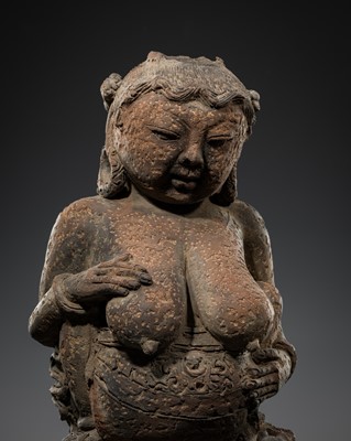 Lot 511 - A MAJAPAHIT TERRACOTTA FIGURE OF A MOTHER GODDESS