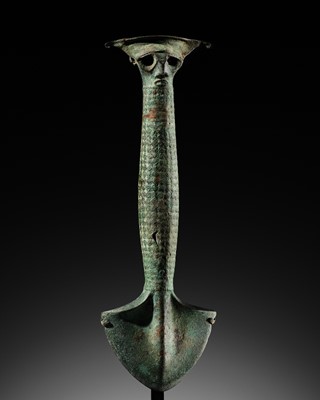 Lot 490 - AN IMPORTANT AND LARGE BRONZE RITUAL AXE, INDONESIA, NORTH SUMATRA, CIRCA 500 BC-300 AD