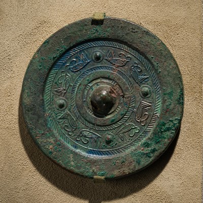 Lot 143 - A BRONZE MIRROR WITH PAIRED BIRDS, HAN DYNASTY