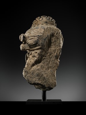 Lot 248 - A LARGE SCHIST HEAD OF A BODHISATTVA WITH A ‘KĪRTIMUKHA’ TURBAN, GANDHARA, 4TH–5TH CENTURY, FORMERLY IN THE COLLECTION OF BEGUM BAKHT ZEBA