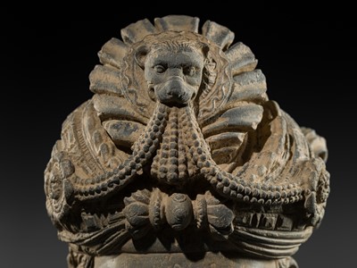 Lot 248 - A LARGE SCHIST HEAD OF A BODHISATTVA WITH A ‘KĪRTIMUKHA’ TURBAN, GANDHARA, 4TH–5TH CENTURY, FORMERLY IN THE COLLECTION OF BEGUM BAKHT ZEBA