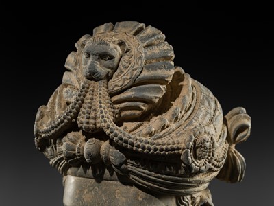 Lot 248 - A LARGE SCHIST HEAD OF A BODHISATTVA WITH A ‘KĪRTIMUKHA’ TURBAN, GANDHARA, 4TH–5TH CENTURY, FORMERLY IN THE COLLECTION OF BEGUM BAKHT ZEBA