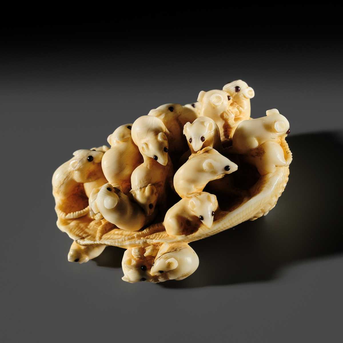 Lot 256 - MASAMITSU: A CHARMING IVORY NETSUKE OF AN