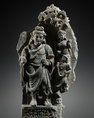 Lot 404 - A GRAY SCHIST RELIEF DEPICTING SIDDHARTHA WITH NOBLE PATRONS, ANCIENT REGION OF GANDHARA, 2ND-4TH CENTURY