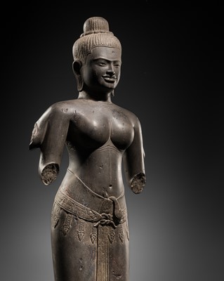 Lot 431 - A RARE AND IMPORTANT SANDSTONE FIGURE OF UMA, ANGKOR PERIOD, 10TH-12TH CENTURY