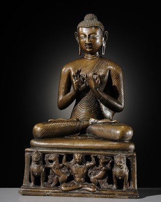 Lot 80 - A LARGE SILVER AND COPPER-INLAID BRASS FIGURE OF BUDDHA SHAKYAMUNI, KASHMIR STYLE