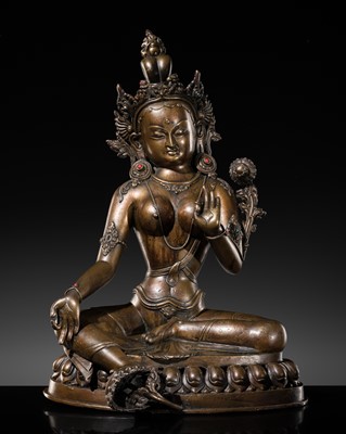 Lot 73 - AN INLAID BRONZE FIGURE OF GREEN TARA, NEPAL, 19TH-MID 20TH CENTURY