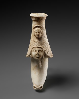 Lot 385 - A WESTERN ASIATIC ALABASTER RHYTON WITH MOTHER GODDESS AND CHILD