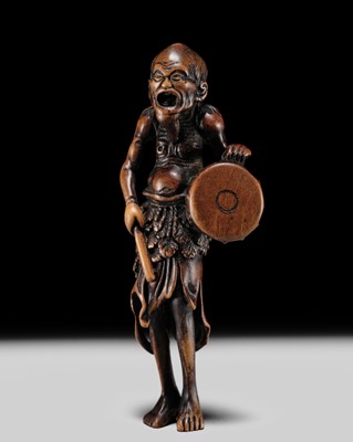 AN EARLY EDO SCHOOL WOOD NETSUKE OF A DRUMMING ISLANDER