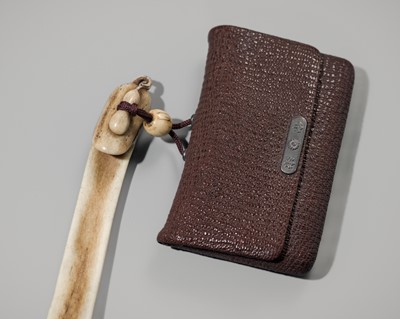 KOKU: A FINE ANTLER OBIHASAMI NETSUKE, WITH A TABAKO-IRE (TOBACCO POUCH)