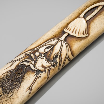 KOKU: A SUPERB ANTLER ‘CRAB AND LOTUS’ KISERUZUTSU (PIPE CASE), WITH A TABAKO-IRE (TOBACCO POUCH)