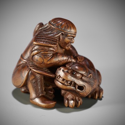 MASAKATA: A FINE AND RARE WOOD NETSUKE OF HADESU SLAYING THE TIGER