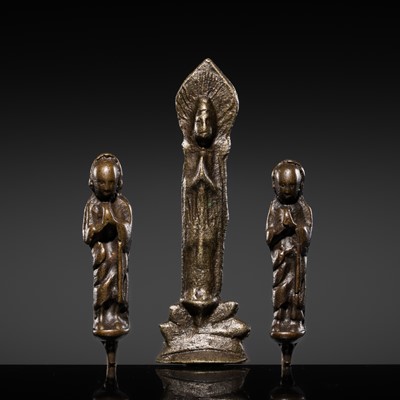 Lot 120 - A RARE BRONZE TRIAD OF BUDDHA WITH ANANDA AND KASHYAPA, NORTHERN WEI-EARLY TANG DYNASTY