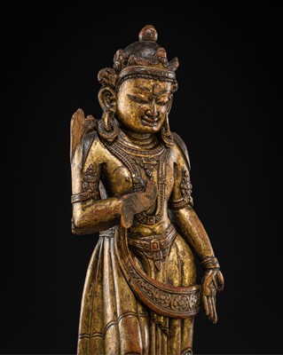 Lot 49 - A RARE GILT-LACQUERED WOOD FIGURE OF TARA, NEPAL, MALLA PERIOD, CIRCA 14TH-15TH CENTURY