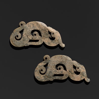 Lot 208 - A FINE PAIR OF GREEN JADE ‘DRAGON’ SILHOUETTE PENDANTS, WARRING STATES PERIOD