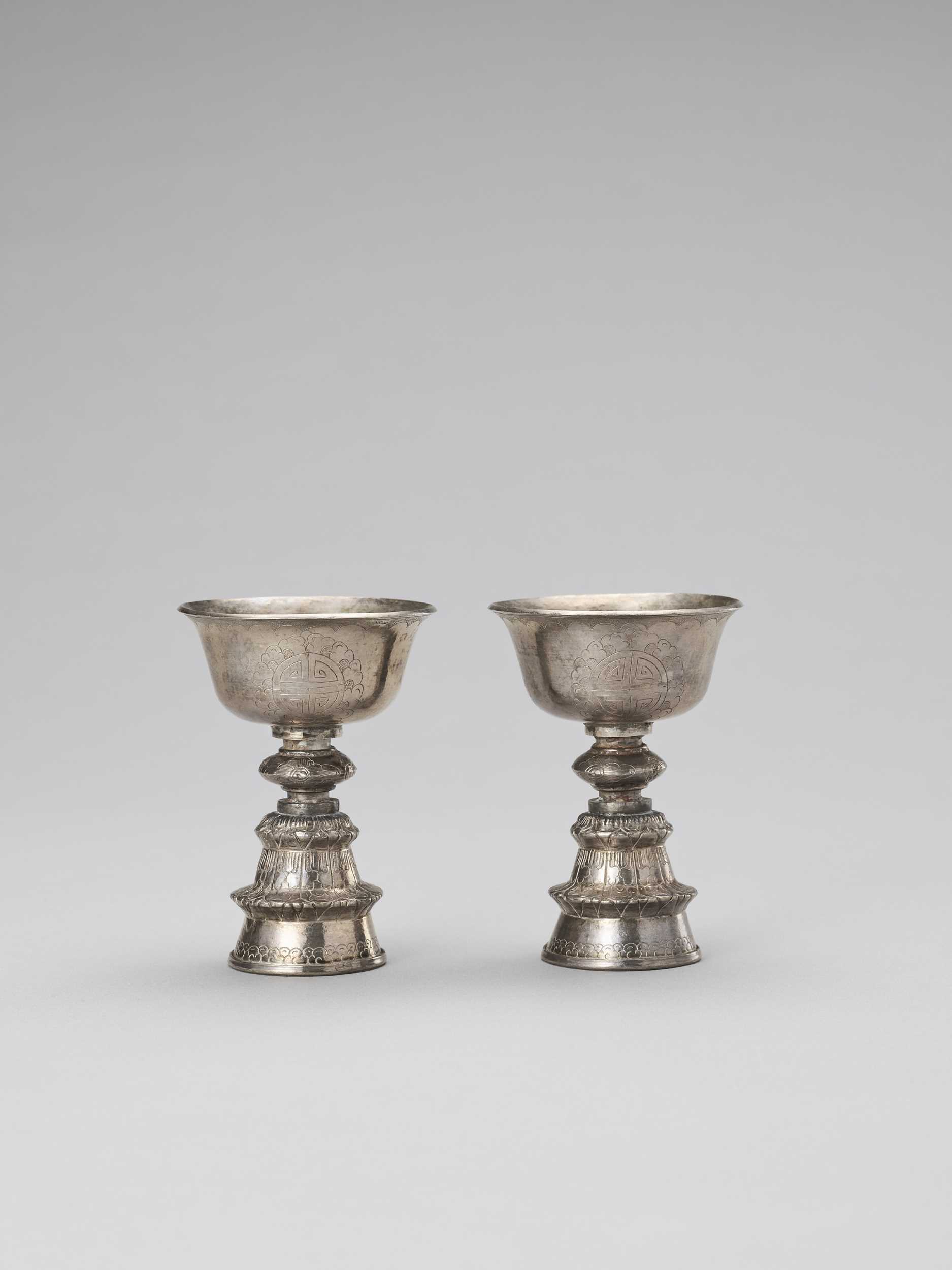 Lot 170 - A PAIR OF SINO-TIBETAN BUTTER LAMPS, LATE 19TH CENTURY