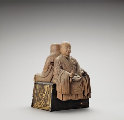 Lot 83 - A PAIR OF HINOKI WOOD FIGURES OF DARUMA AND A RAKAN ON A LACQUER-GILT WOOD BASE