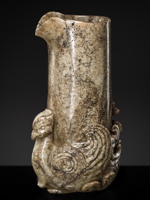 Lot 219 - AN ARCHAISTIC PALE GRAY AND CREAMY-WHITE JADE ‘PHOENIX’ RHYTON, LATE MING TO EARLY QING DYNASTY