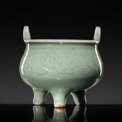 Lot 255 - A CARVED LONGQUAN CELADON ‘LOTUS’ TRIPOD CENSER, MING DYNASTY