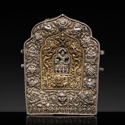 Lot 19 - A FINE RETICULATED AND EMBOSSED PARCEL-GILT SILVER AND COPPER PORTABLE SHRINE WITH TSA-TSA, GAU