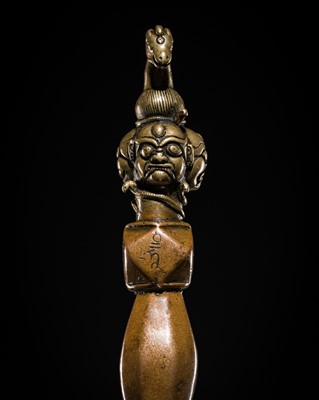 Lot 1 - A RARE AND MASSIVE BRASS, COPPER AND IRON ‘HAYAGRIVA’ PHURBA, TIBET, CIRCA 12TH-13TH CENTURY