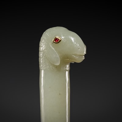Lot 352 - A MUGHAL RUBY-INLAID PALE CELADON JADE ‘SHEEP’ HILT, 18TH-19TH CENTURY
