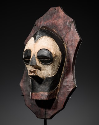 Lot 537 - A SONGYE POLYCHROME WOOD SHIELD WITH A RITUAL MASK, KIFWEBE