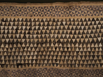 Lot 528 - A KUBA WOVEN RAFFIA AND EMBROIDERED TEXTILE CEREMONIAL OVERSKIRT, NTSHAK, LATE 19TH-EARLY 20TH CENTURY