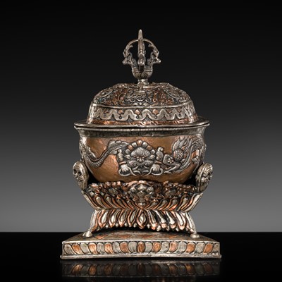 Lot 29 - A PARCEL-COPPERED WHITE METAL REPOUSSÉ KAPALA AND STAND, TIBET, 19TH CENTURY