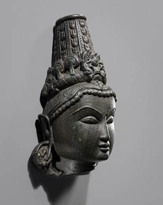 Lot 333 - A BLACK STONE HEAD OF INDRA, SOLANKI DYNASTY, 11TH-12TH CENTURY