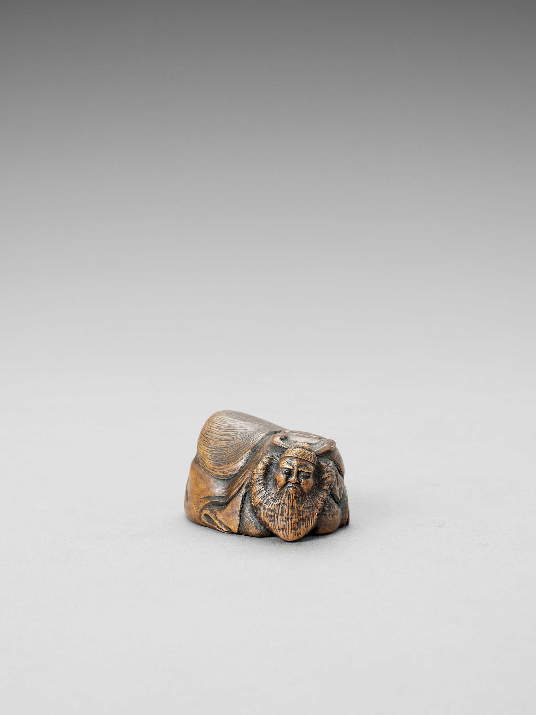 Lot 280 - A WOOD SHUNGA OKIMONO-NETSUKE OF SHOKI AND OKAME