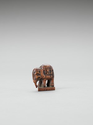 Lot 356 - A WOOD NETSUKE OF A CAPARISONED ELEPHANT