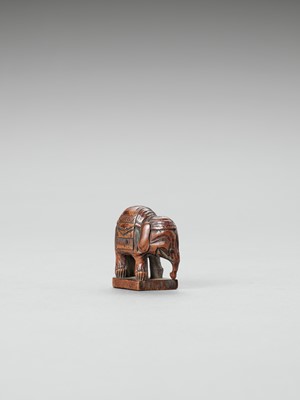 Lot 356 - A WOOD NETSUKE OF A CAPARISONED ELEPHANT