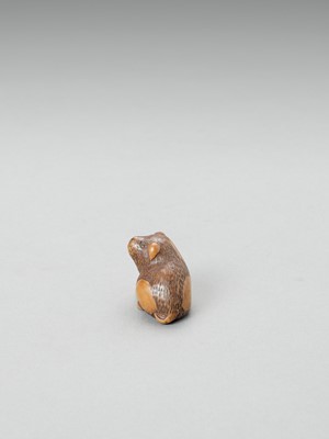 Lot 351 - MASANOBU: A YAMADA SCHOOL WOOD NETSUKE OF A PIEBALD PUPPY