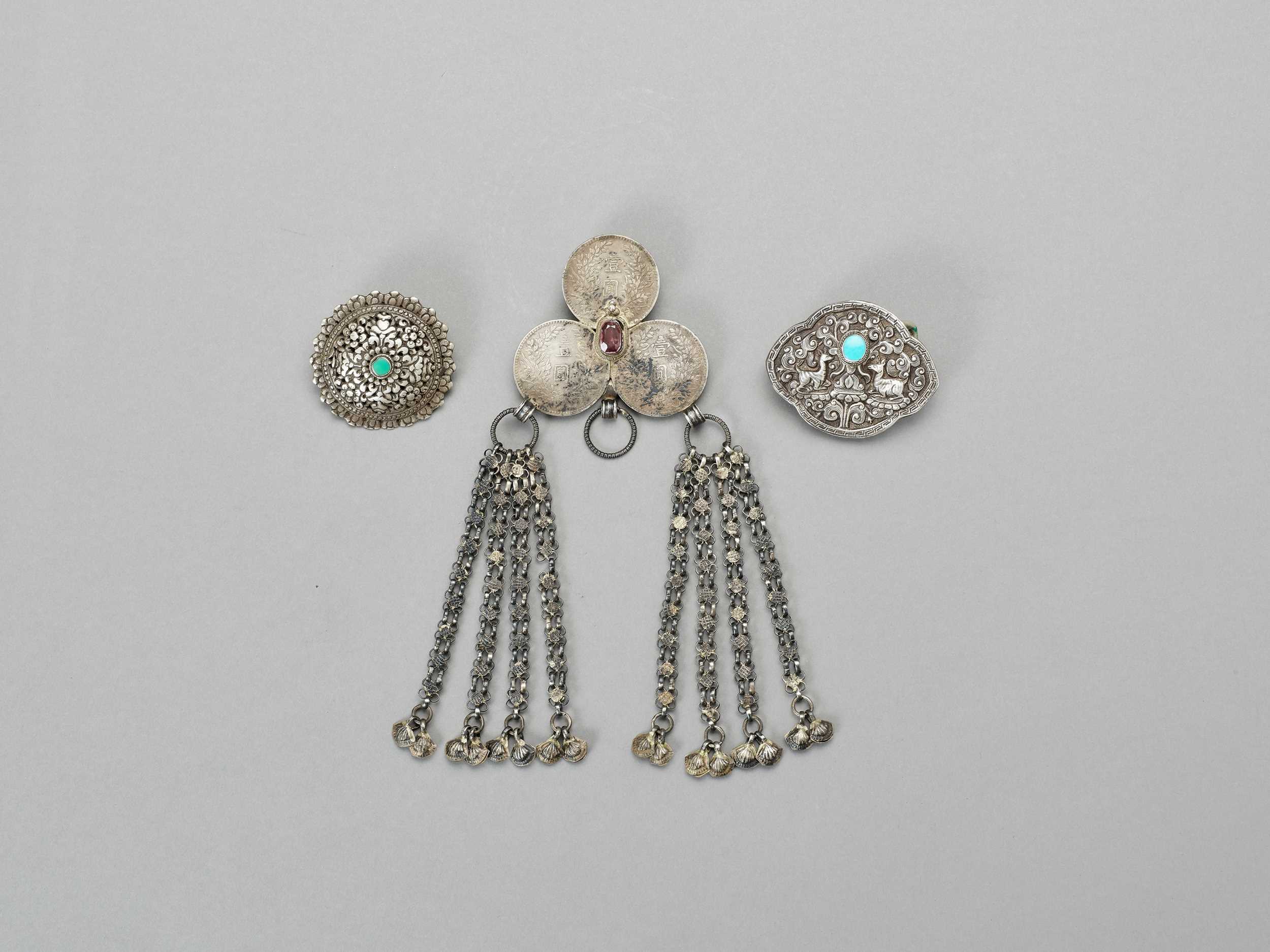 Lot 894 - A GROUP OF THREE SILVER AND SILVER-PLATE BELT ORNAMENTS