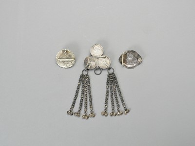 Lot 894 - A GROUP OF THREE SILVER AND SILVER-PLATE BELT ORNAMENTS