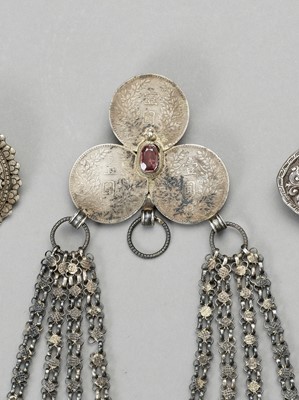 Lot 894 - A GROUP OF THREE SILVER AND SILVER-PLATE BELT ORNAMENTS