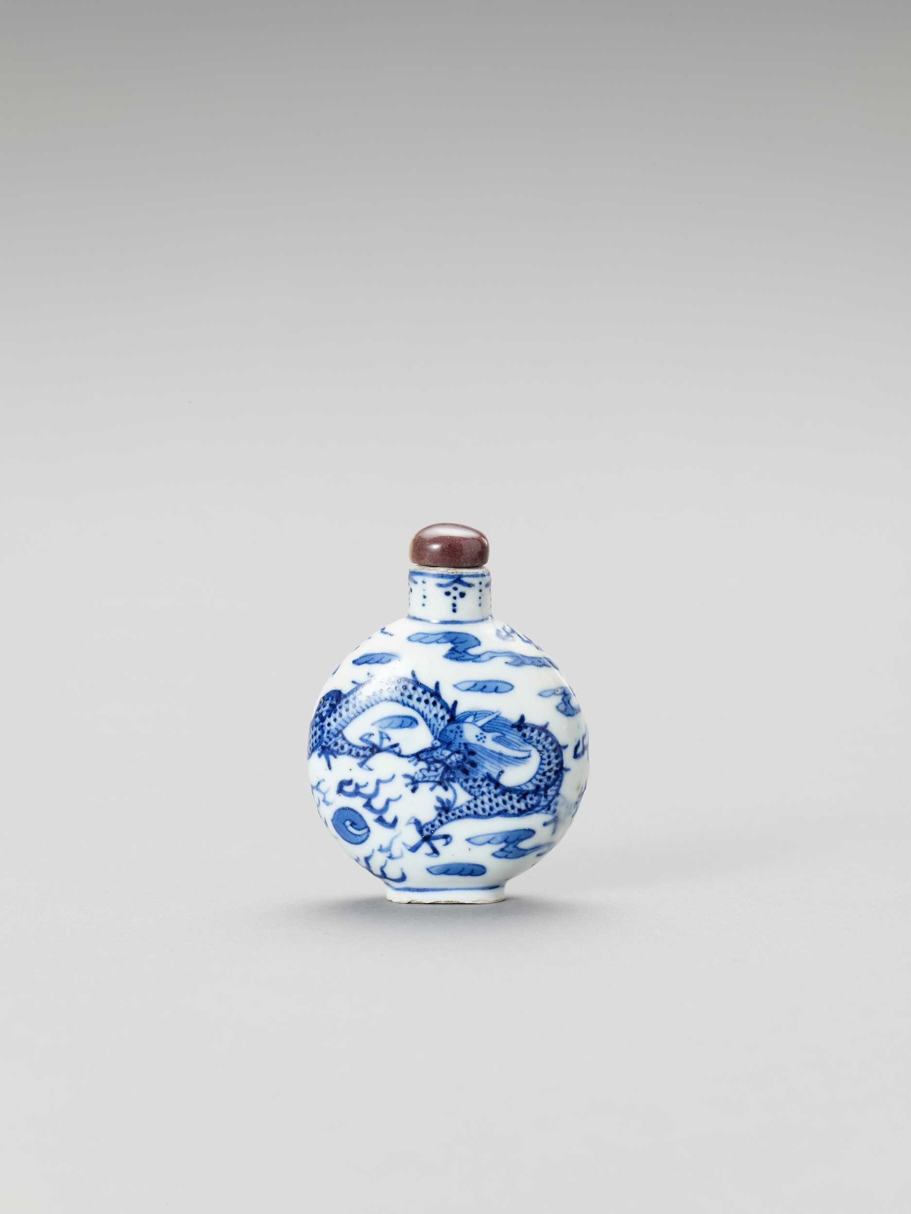 Lot 831 - A BLUE AND WHITE PORCELAIN 'DRAGON' SNUFF BOTTLE
