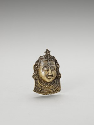 Lot 1253 - AN INDIAN BRASS MOHRA OF SHIVA