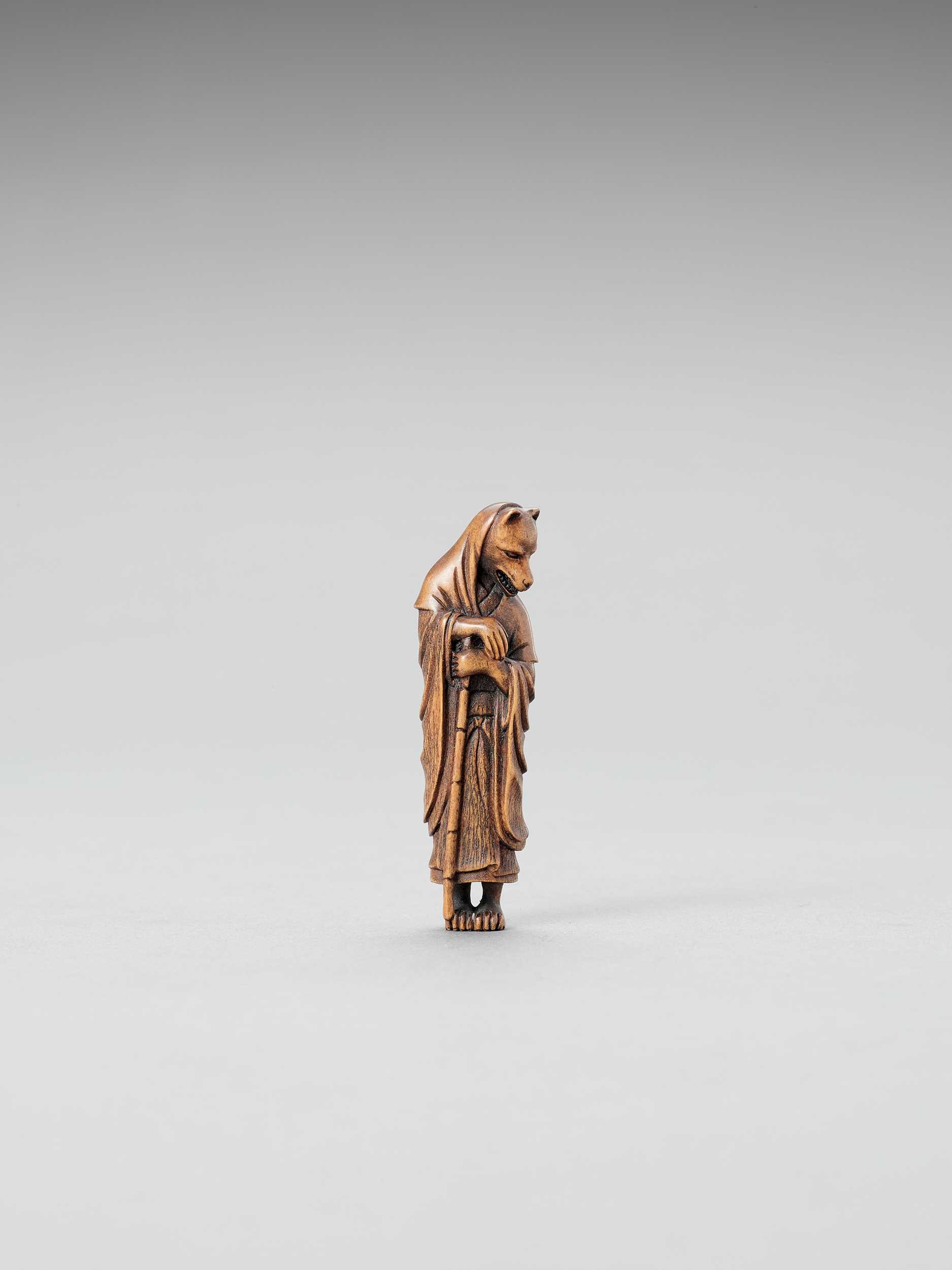 Lot 301 - A MINIATURE OKIMONO OF A FOX PRIEST (HAKUZOSU)