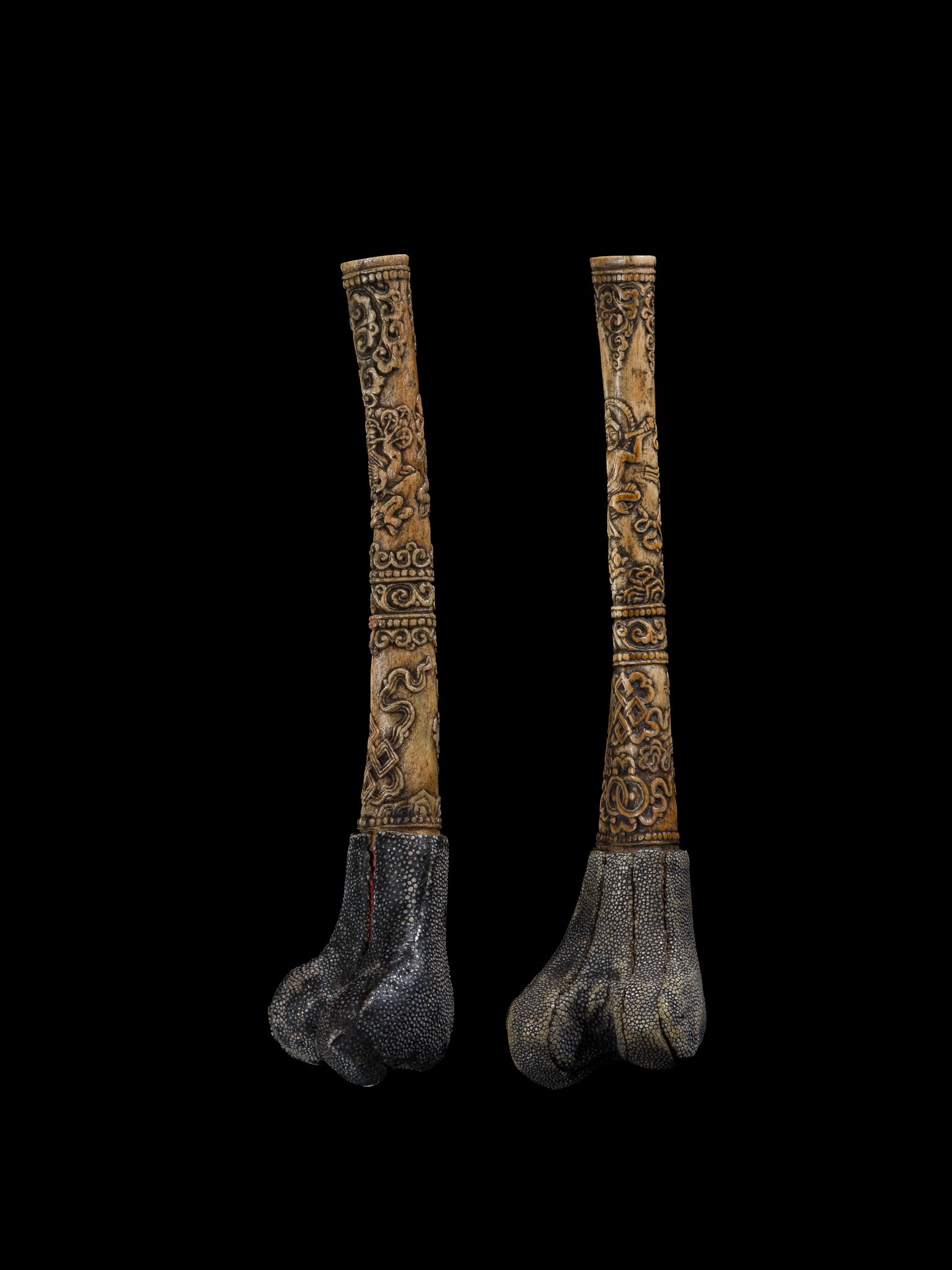 Lot 254 - A PAIR OF CARVED LEG BONE TRUMPETS, KANGLING,