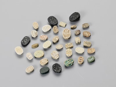 Lot 1332 - THIRTY-FIVE EGYPTIAN FAIENCE AND STONE MINIATURE SEALS AND BEADS