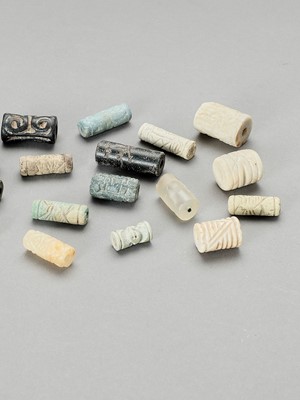 Lot 1331 - TWENTY-TWO BABYLONIAN CYLIDER SEALS AND BEADS