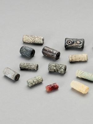 Lot 1331 - TWENTY-TWO BABYLONIAN CYLIDER SEALS AND BEADS