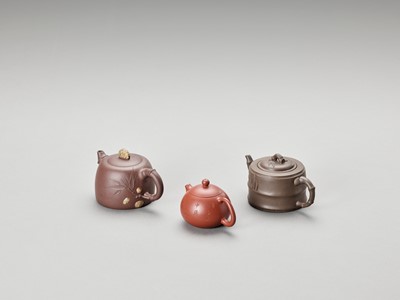 Lot 722 - THREE YIXING TEAPOTS AND COVERS, LATE QING TO REPUBLIC