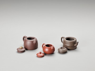 Lot 722 - THREE YIXING TEAPOTS AND COVERS, LATE QING TO REPUBLIC